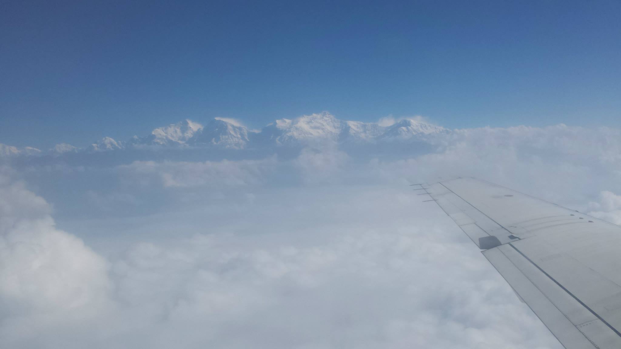 The Himalayas from the window seat — the view every other passenger on the plane was leaning across me to photograph