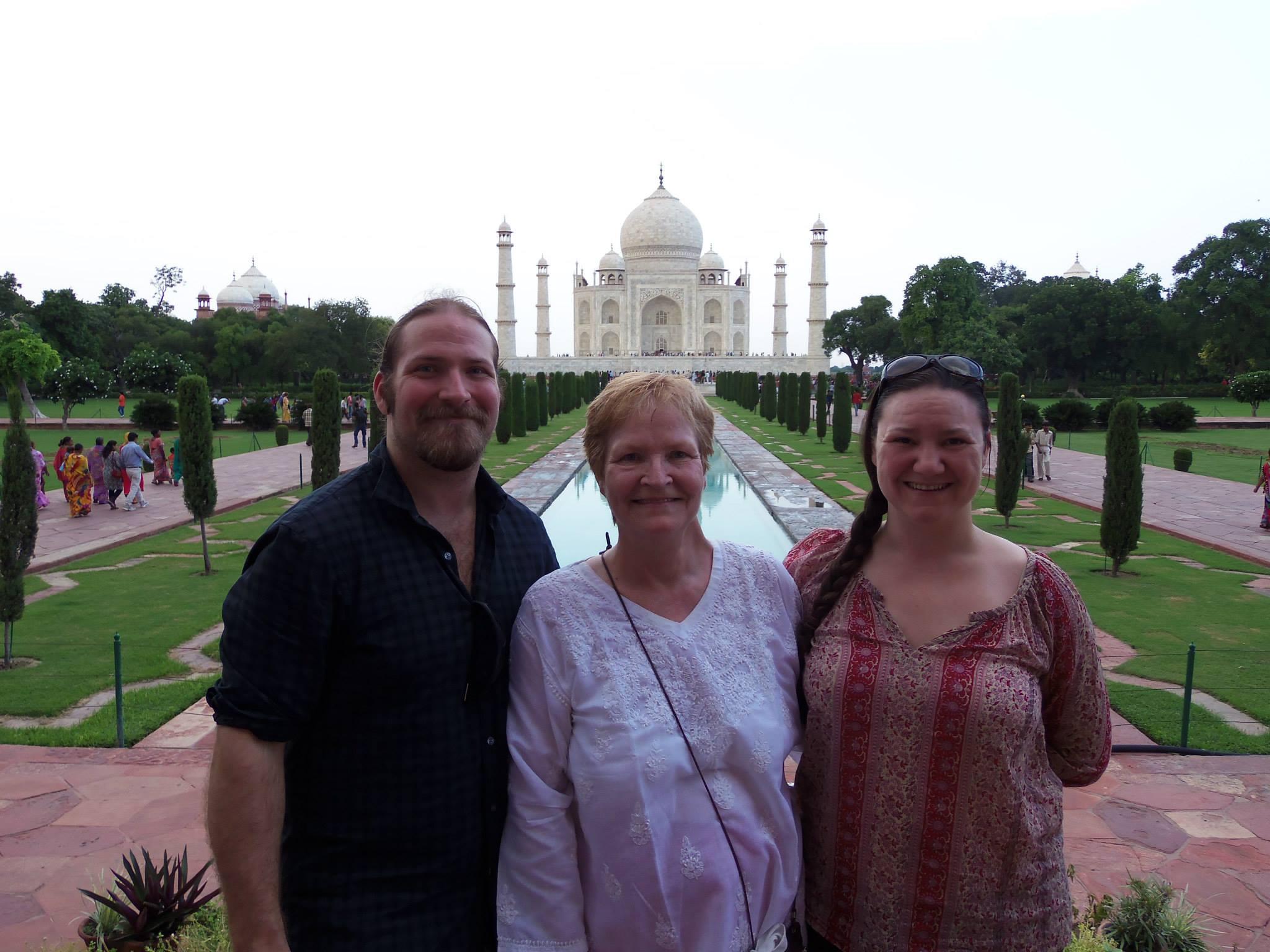 The three of us in front of the Taj Mahal — mom finally got her Wonder