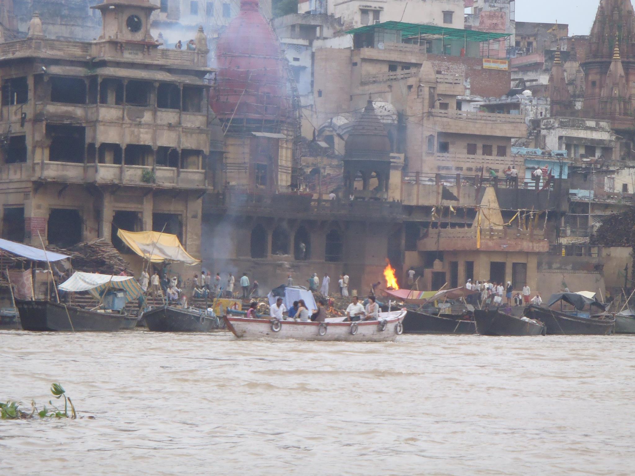The ghats of Varanasi from the river — the steps, the city, the whole thing